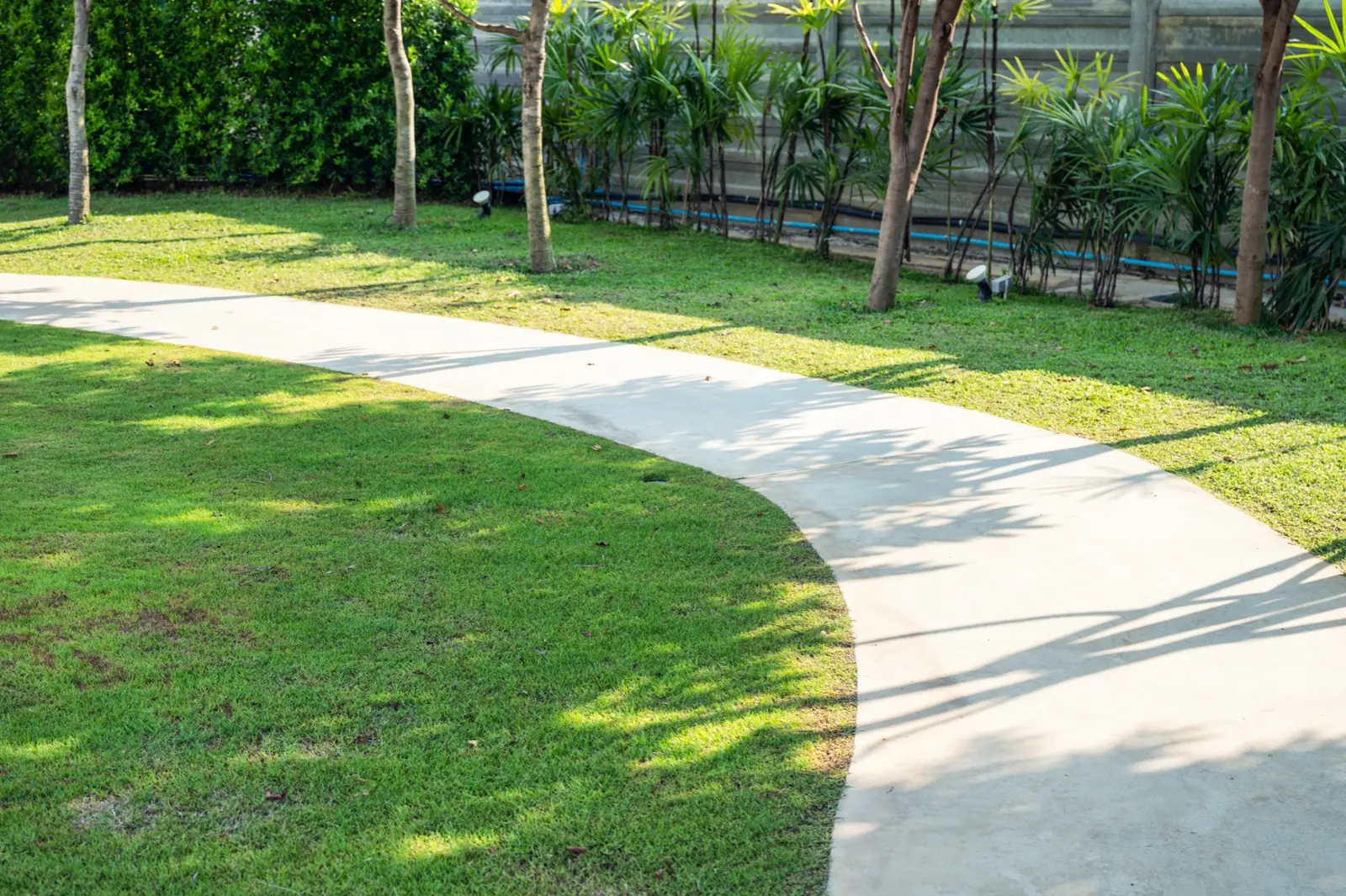 Curved concrete garden footpath